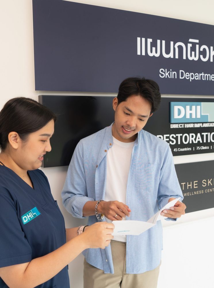 DHI staff consulting the patient